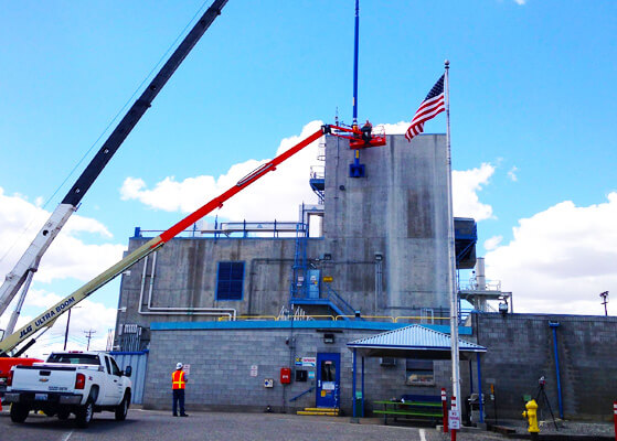 Intermech team members utilizing a crane to complete work at the Washington River Protection Service facility